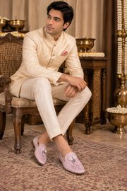 Blush Pink Embroidered Juttis With Tassel Detail