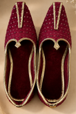 Maroon Velvet Embellished Juttis With Gold Piping