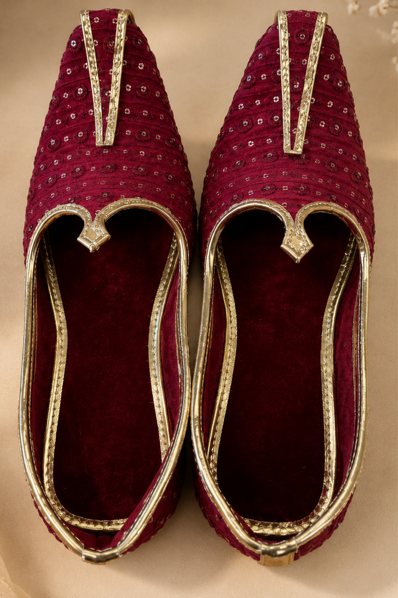 Maroon Velvet Embellished Juttis With Gold Piping